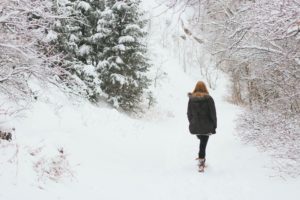 Woman walking in the woods