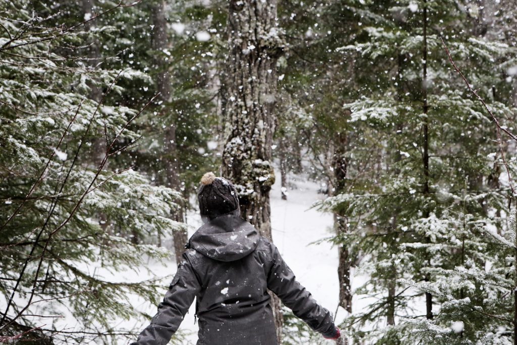 Woman in woods during the holidays