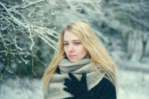 Woman standing in the snow