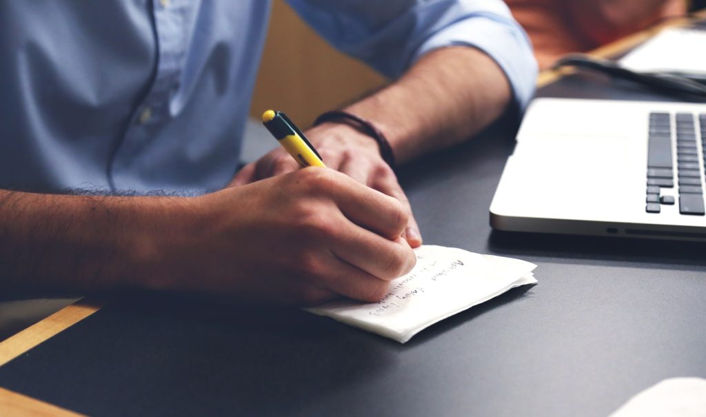 Man taking note on Prevalence & Features of Eating Disorders in Males