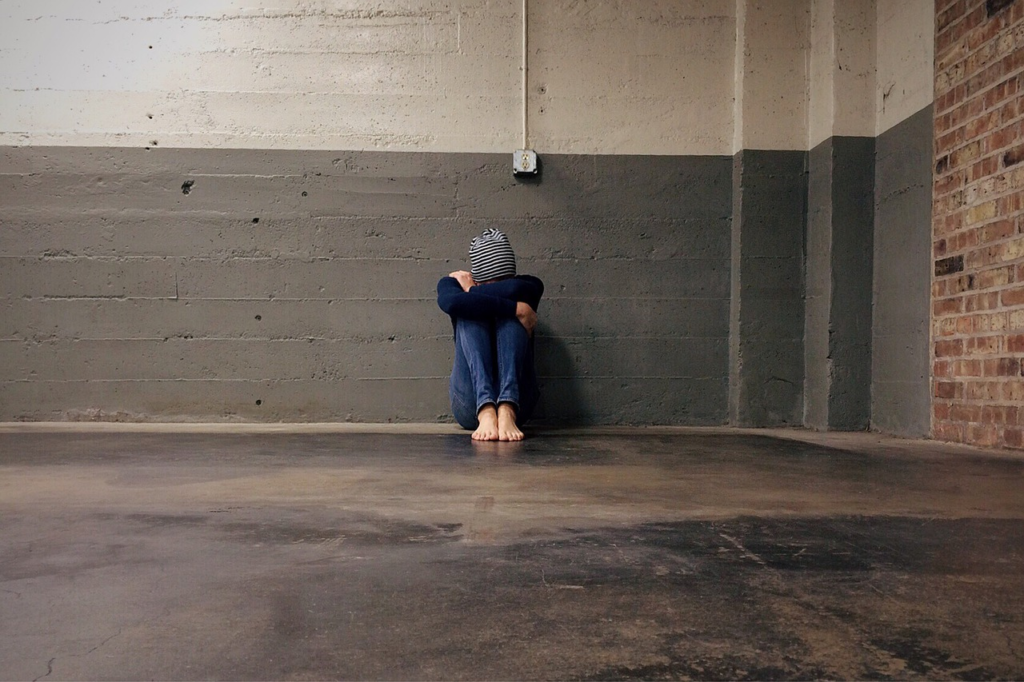 Young man struggling with Body Dysmorphic Disorder