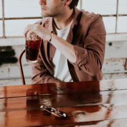 Man drinking sugar-sweetened beverages