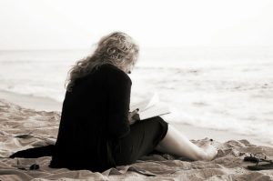 Lady sitting on the beach