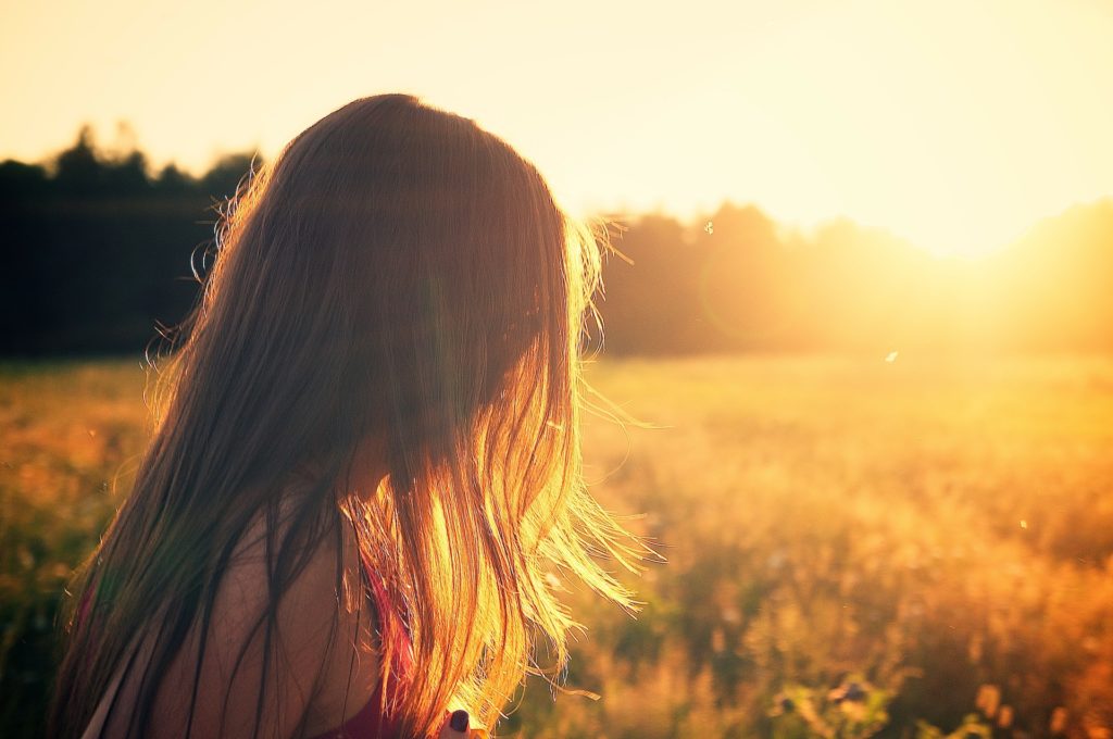 Girl walking in a field