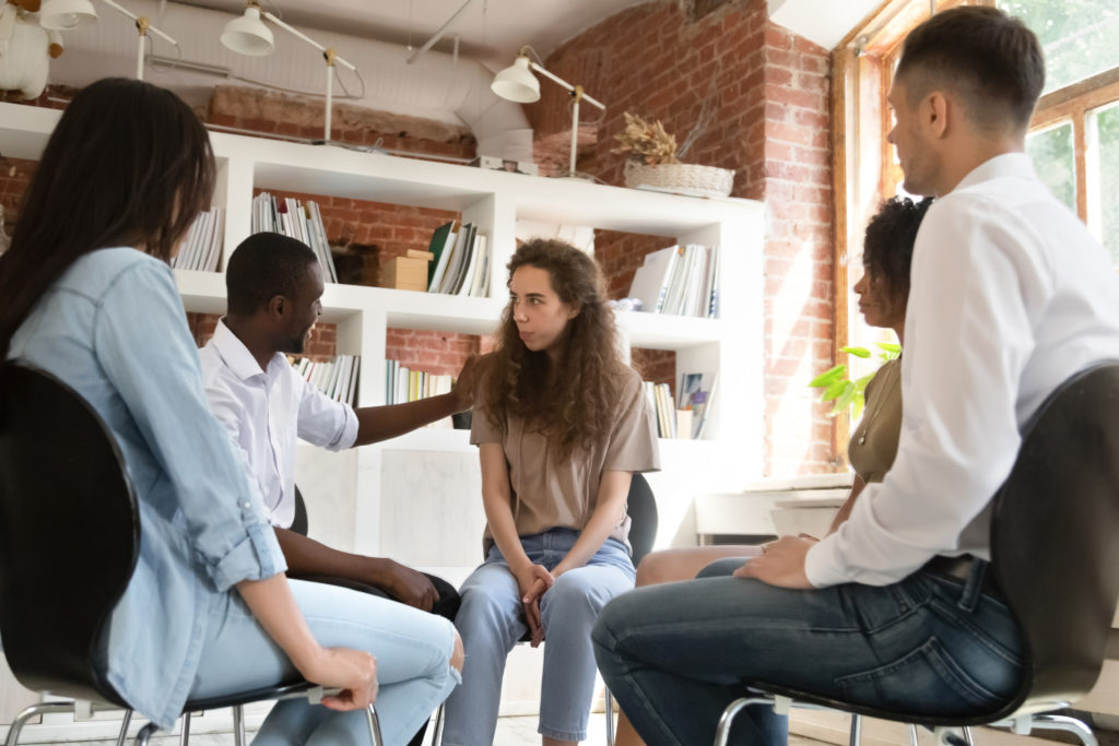 Young Lady in Group therapy after Returning to Eating Disorder Treatment