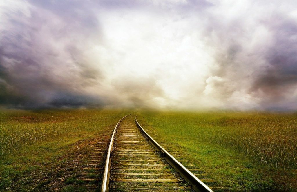 Nature Railroad Tracks into Stormy Clouds