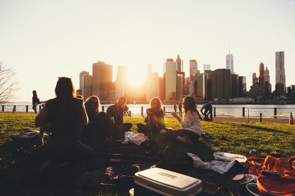 People on lake shore during summer