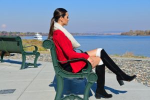 Hispanic Woman Sitting on Bench thinking about Harm Reduction