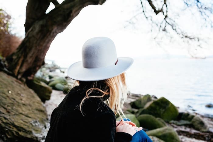 woman thinking by water