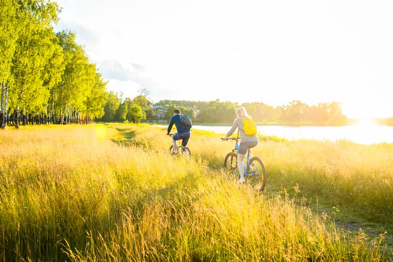 Two people riding bikes