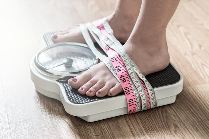 Woman on Weight Scale