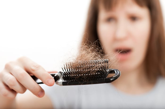woman with hair brush