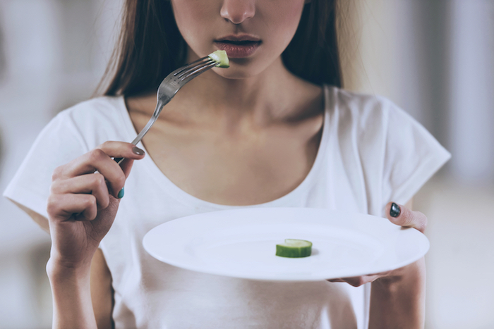 girl with empty plate in hand