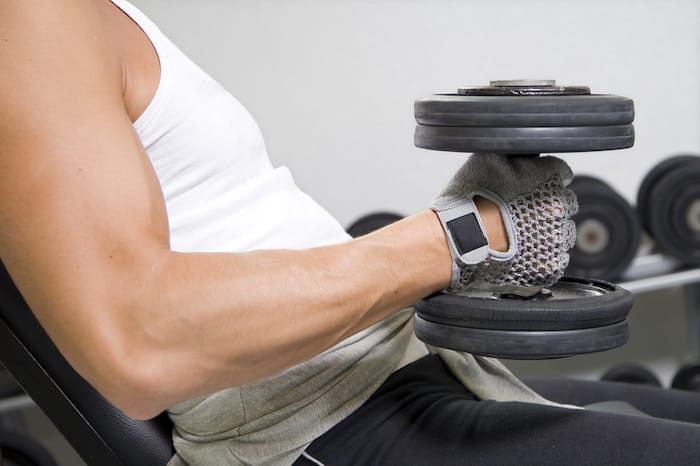 man with weights in hand