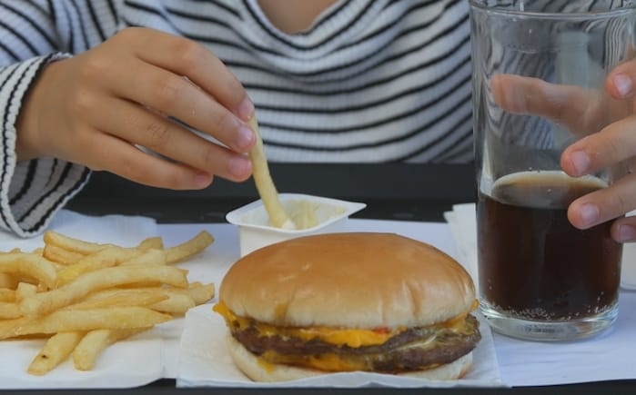 child eating fast food